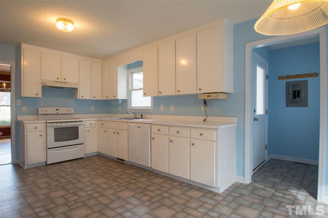 500 Jordan Ridge Lane Raleigh, NC 27603 - Photo 8 of 12 a kitchen with cabinets appliances and a window