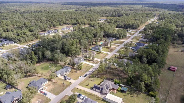 an aerial view of houses with outdoor space