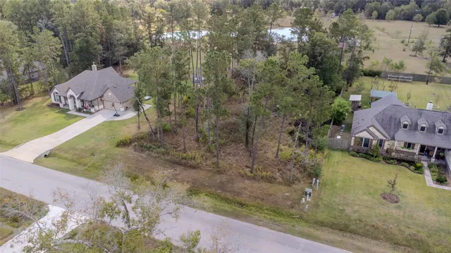 a view of a house with a yard and a large pool