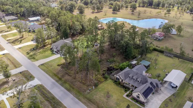 an aerial view of a house with outdoor space