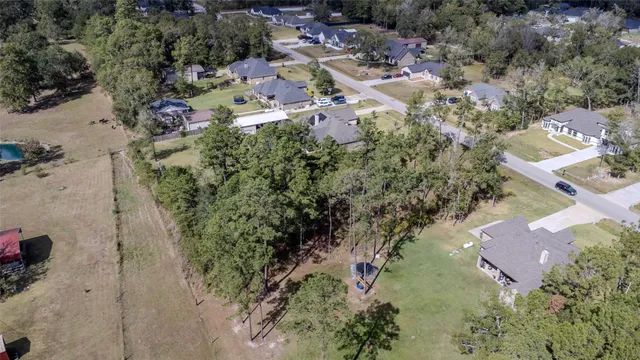 an aerial view of residential house with outdoor space