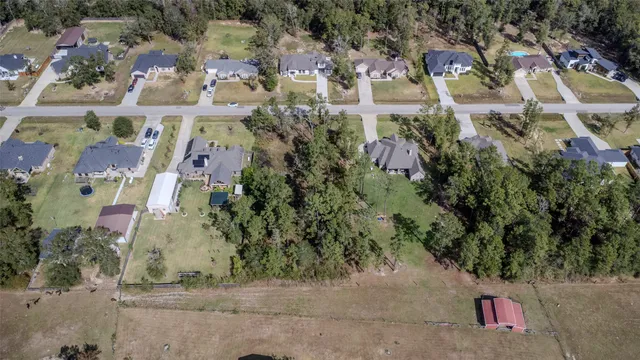 an aerial view of residential house with outdoor space