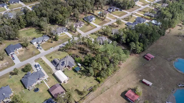 an aerial view of residential house with outdoor space