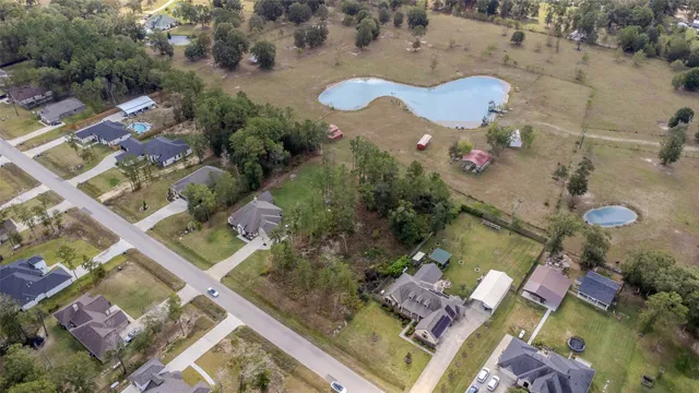 an aerial view of house with yard