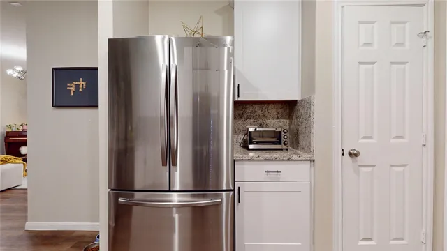 a bathroom with a sink a toilet and shower curtain