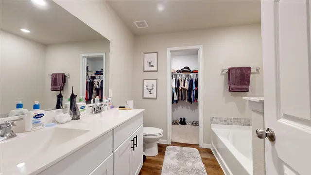 a bathroom with a tub and a shower