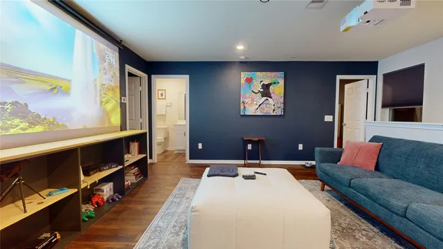 a white toilet sitting next to a small bathroom