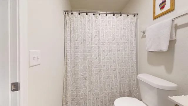 a bed room with a bed and a lamp