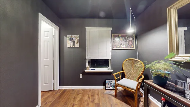 a view of a backyard with wooden fence