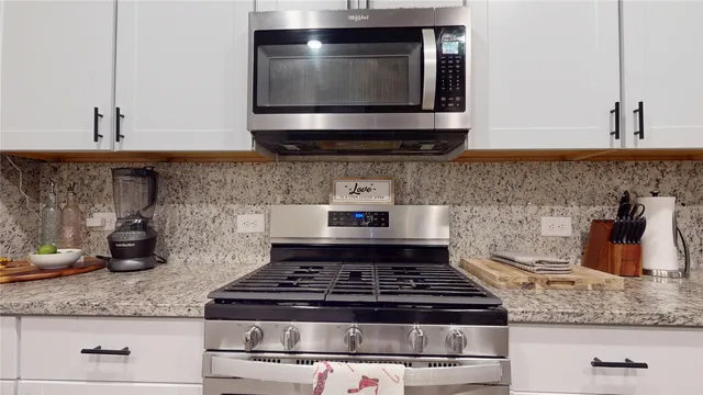 a kitchen with a refrigerator and cabinets