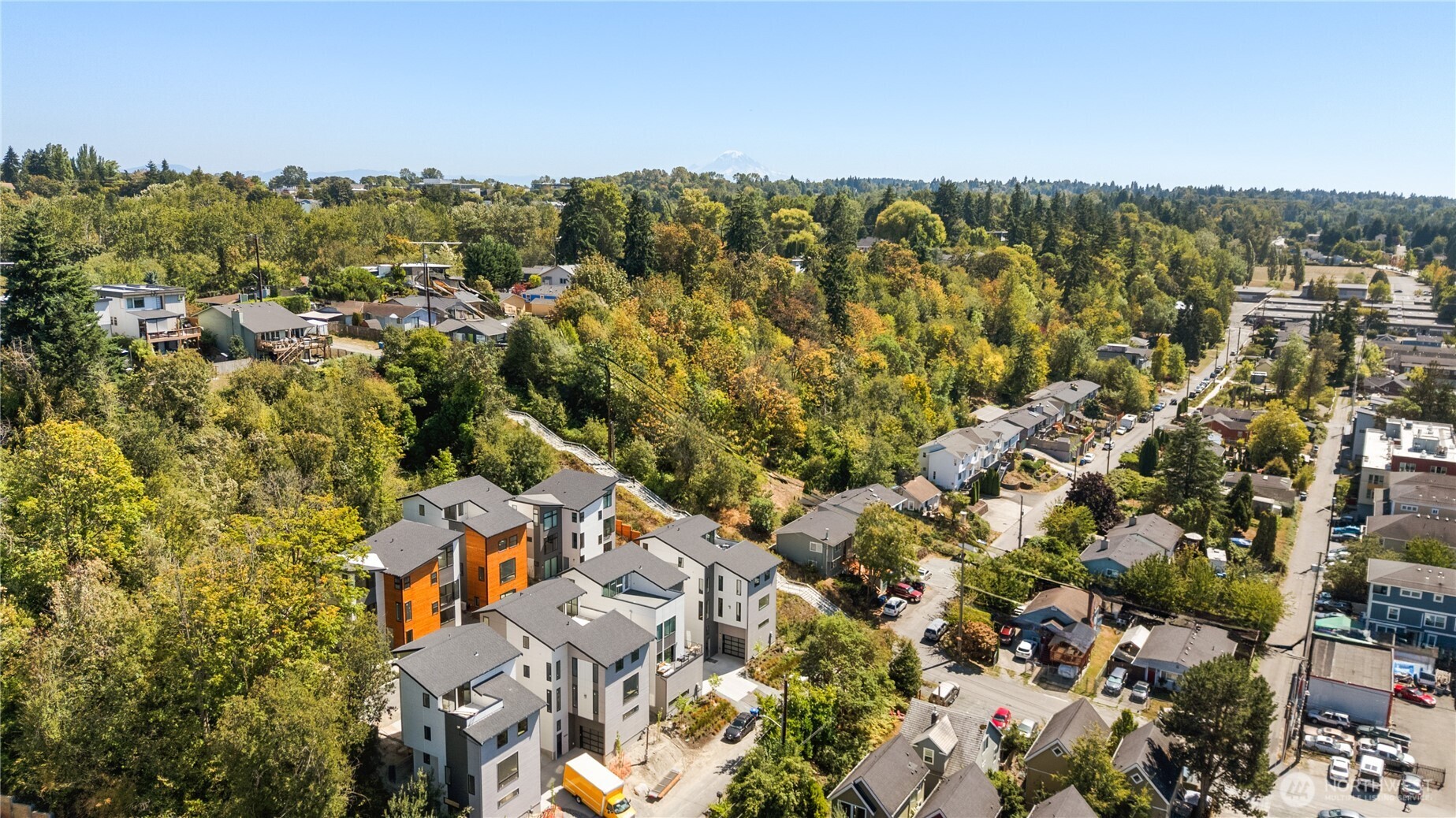 an aerial view of residential building with parking space