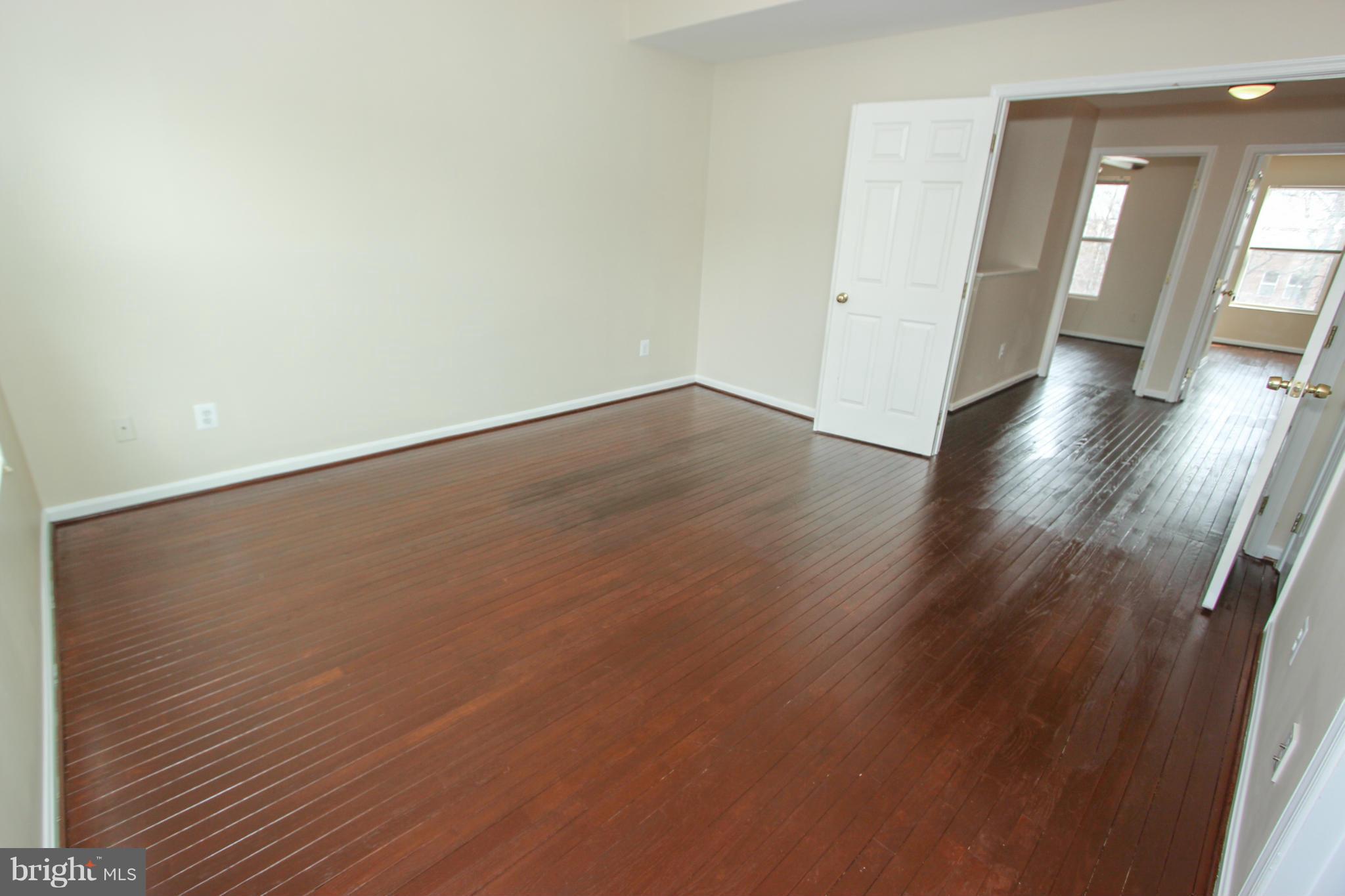 1706 Random Stone Court Reston, VA 20190 - Photo 14 of 30 an empty room with wooden floor and windows