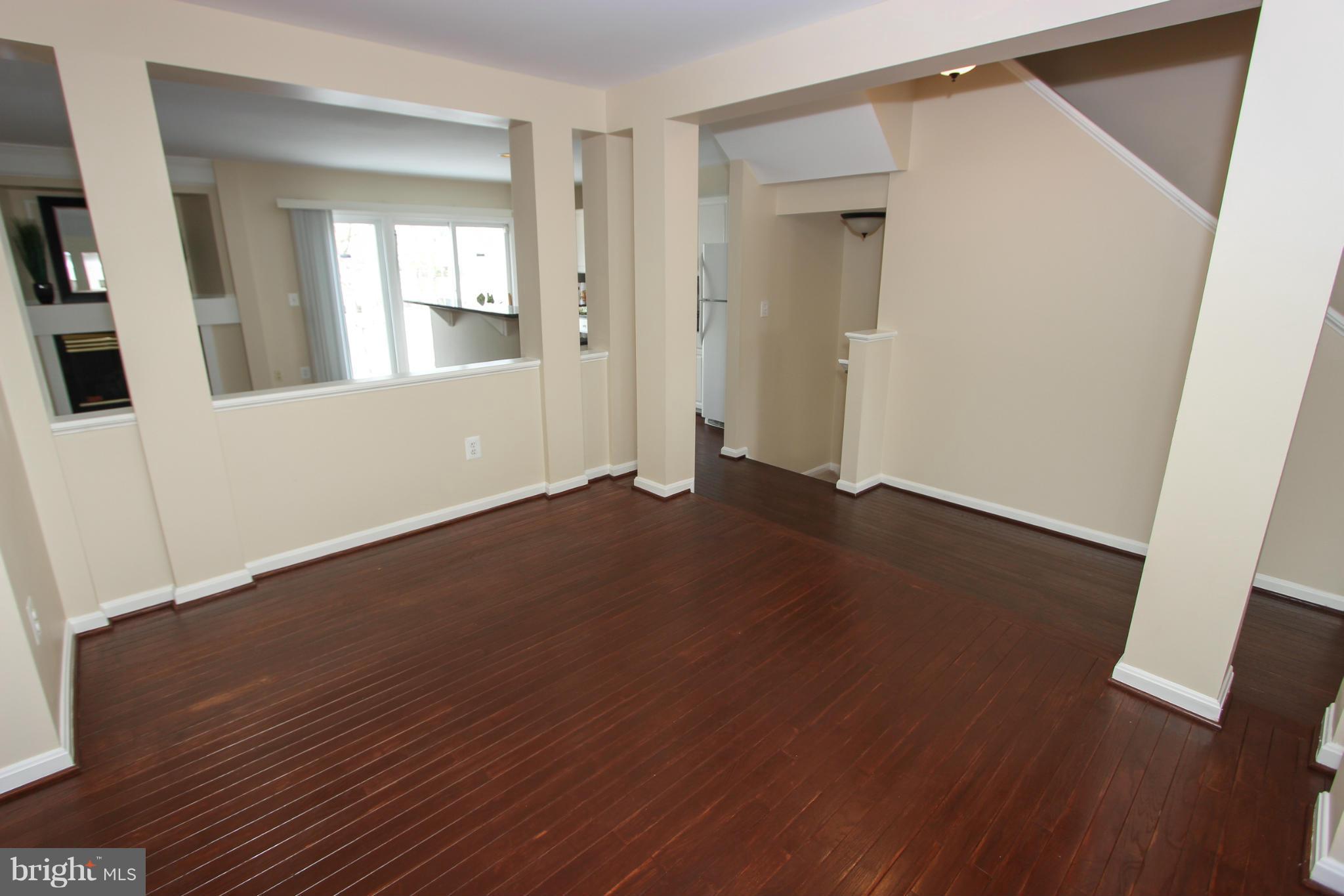 1706 Random Stone Court Reston, VA 20190 - Photo 20 of 30 an empty room with wooden floor and windows