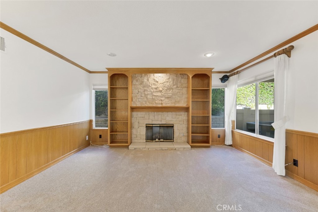 19641 Falcon Ridge Way Porter Ranch, CA 91326 - Photo 21 of 51 an empty room with furniture and a fireplace