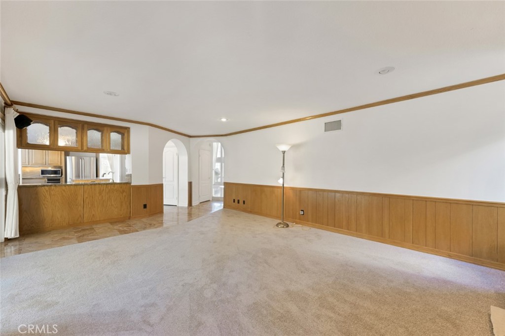 19641 Falcon Ridge Way Porter Ranch, CA 91326 - Photo 22 of 51 an empty room with cabinet and windows