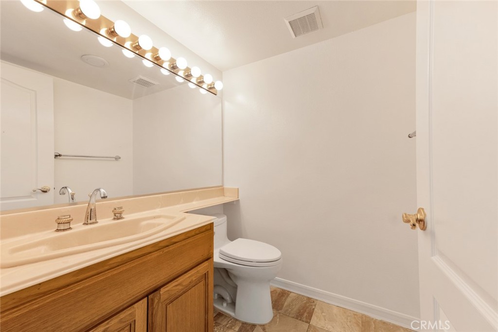 19641 Falcon Ridge Way Porter Ranch, CA 91326 - Photo 24 of 51 a bathroom with a sink a toilet and shower