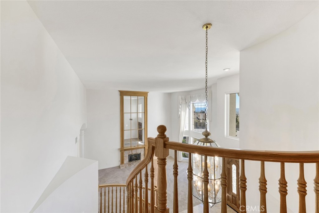 19641 Falcon Ridge Way Porter Ranch, CA 91326 - Photo 28 of 51 a view of a hallway view with staircase