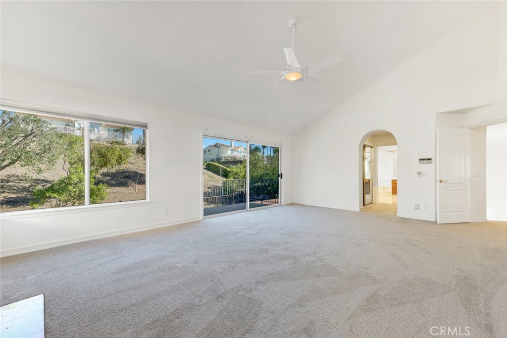 19641 Falcon Ridge Way Porter Ranch, CA 91326 - Photo 31 of 51 an empty room with windows and natural light