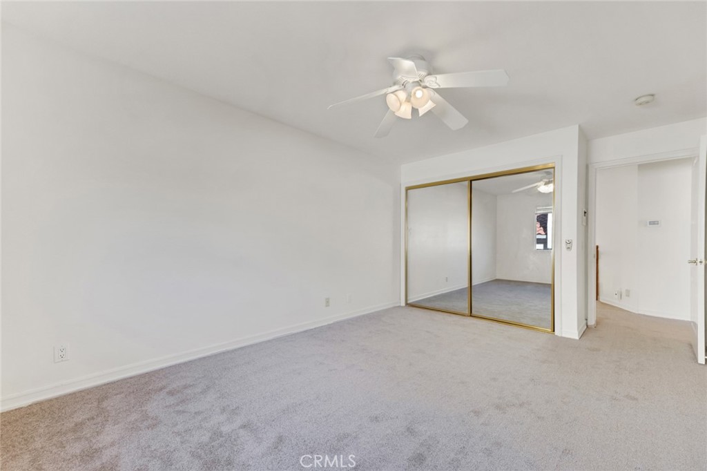 19641 Falcon Ridge Way Porter Ranch, CA 91326 - Photo 36 of 51 a view of an empty room with a chandelier fan