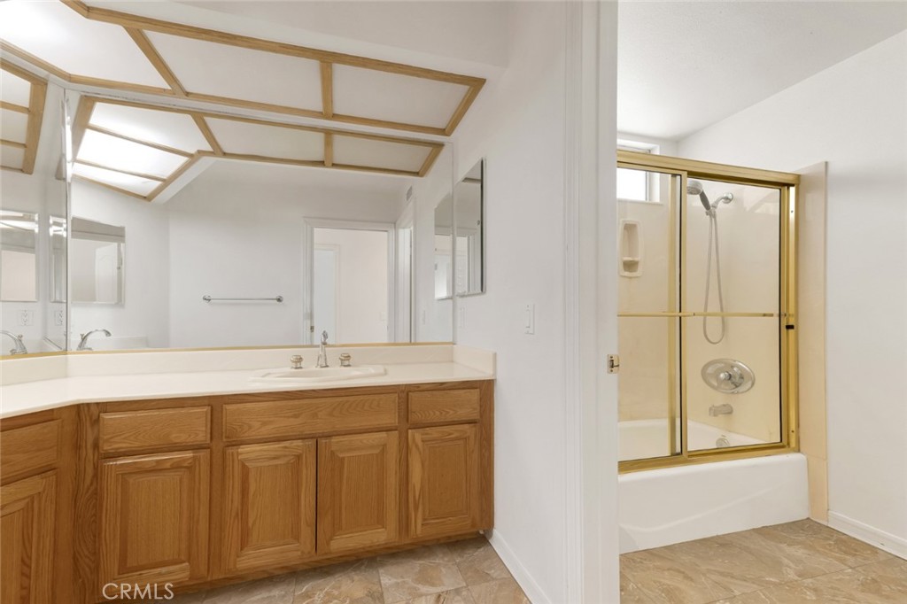 19641 Falcon Ridge Way Porter Ranch, CA 91326 - Photo 38 of 51 a bathroom with a double vanity sink and mirror