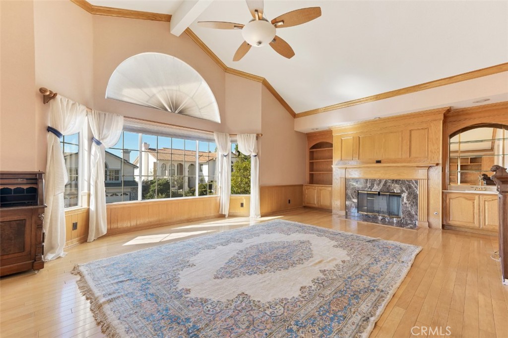 19641 Falcon Ridge Way Porter Ranch, CA 91326 - Photo 41 of 51 a view of a livingroom with wooden floor and a ceiling fan