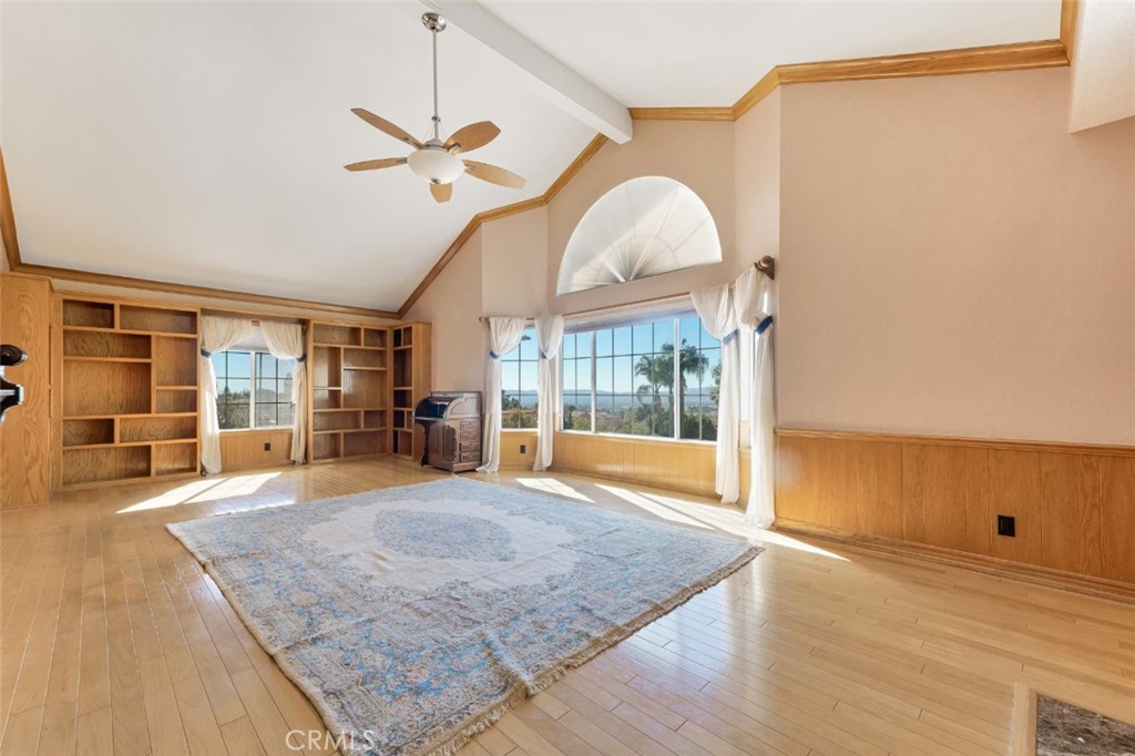 19641 Falcon Ridge Way Porter Ranch, CA 91326 - Photo 42 of 51 a view of a livingroom with wooden floor and a ceiling fan