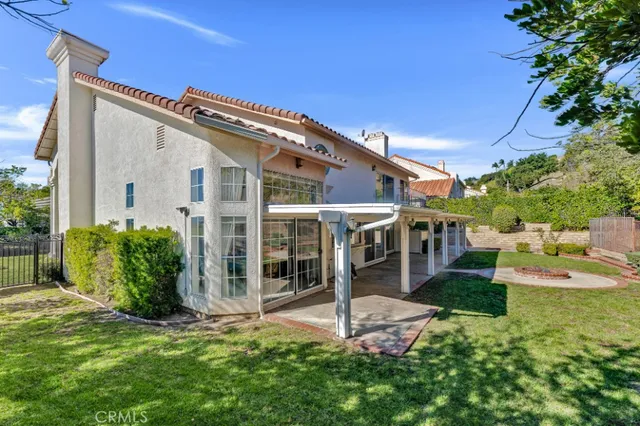 an aerial view of house with yard