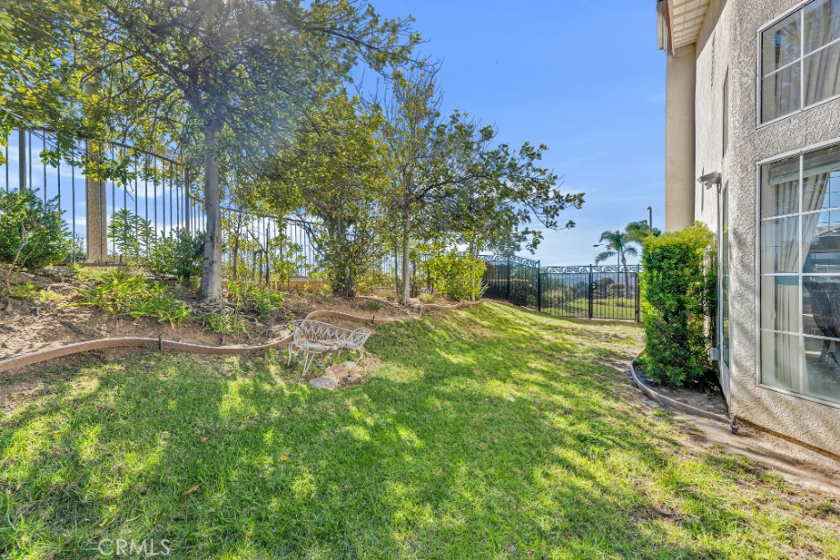 19641 Falcon Ridge Way Porter Ranch, CA 91326 - Photo 47 of 51 a garden with trees in front of it