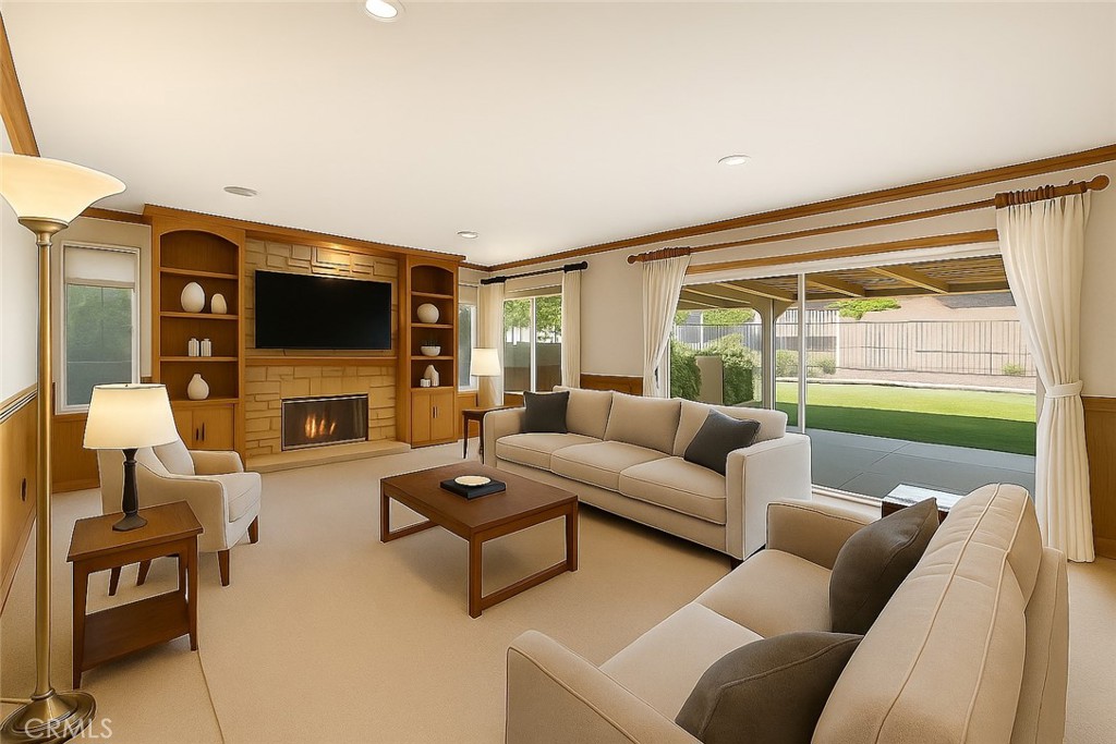 19641 Falcon Ridge Way Porter Ranch, CA 91326 - Photo 6 of 51 a living room with furniture a flat screen tv and a floor to ceiling window