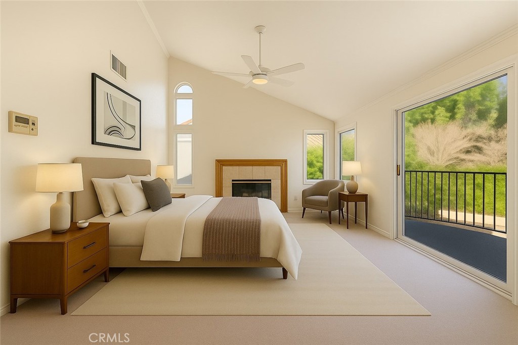 19641 Falcon Ridge Way Porter Ranch, CA 91326 - Photo 7 of 51 a spacious bedroom with a balcony a bed and a fireplace