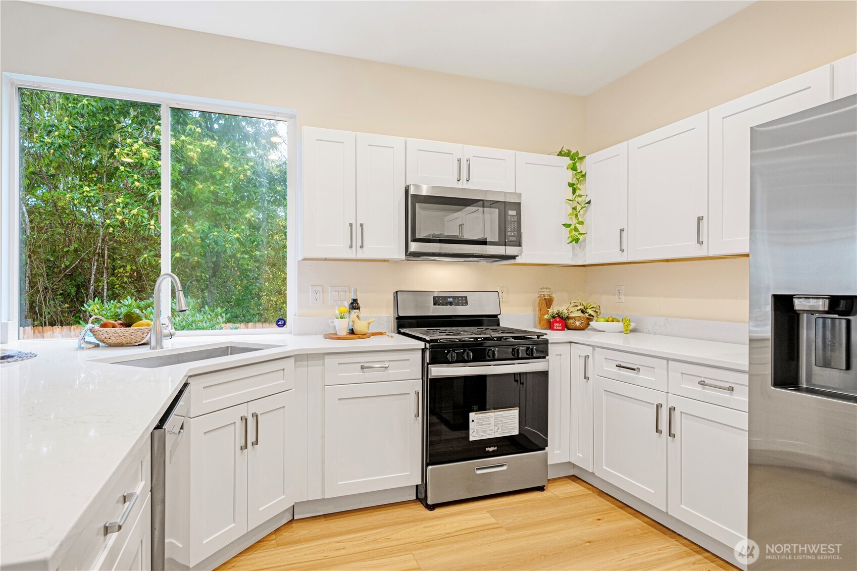 465 Field Place Northeast Renton, WA 98059 - Photo 11 of 25 a kitchen with a stove a sink and a microwave