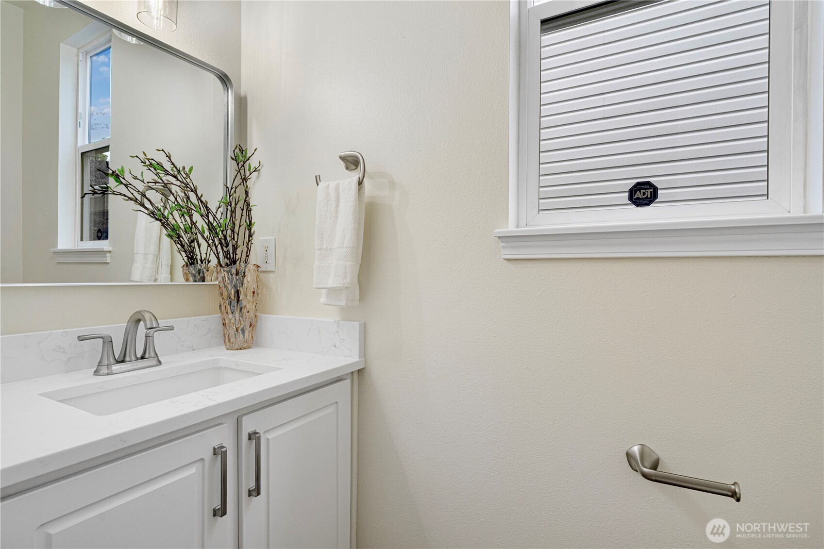 465 Field Place Northeast Renton, WA 98059 - Photo 12 of 25 a bathroom with a sink and a mirror