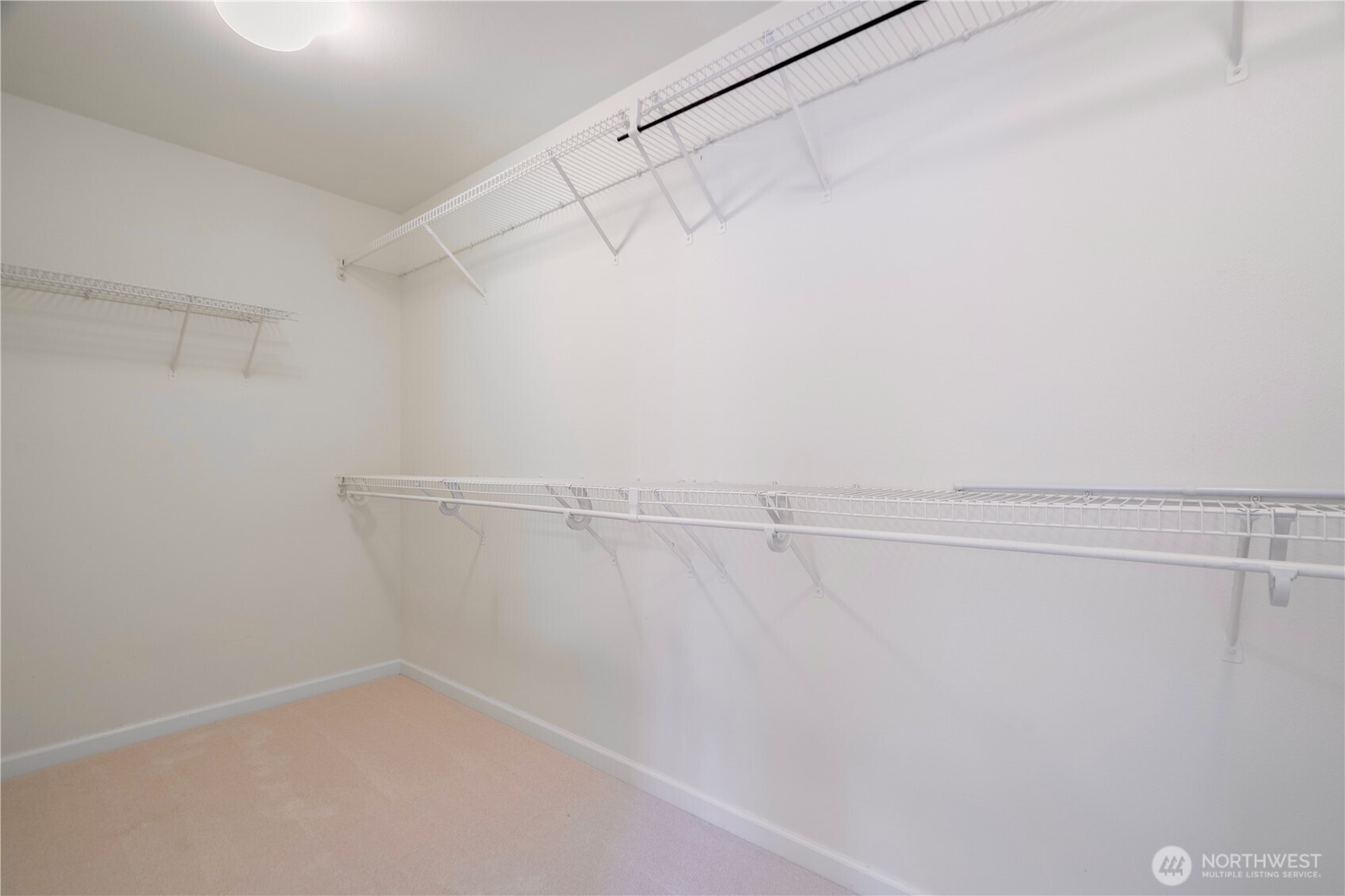 465 Field Place Northeast Renton, WA 98059 - Photo 21 of 25 a view of a room with racks on the wall