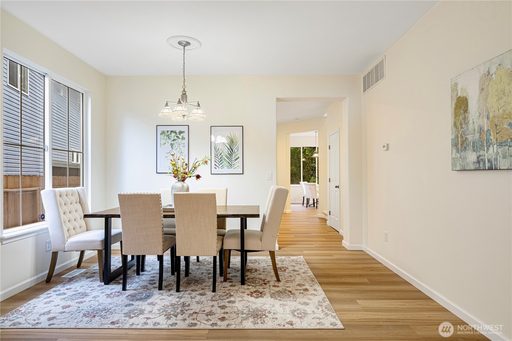 465 Field Place Northeast Renton, WA 98059 - Photo 4 of 25 a view of a a dining room with furniture window and wooden floor