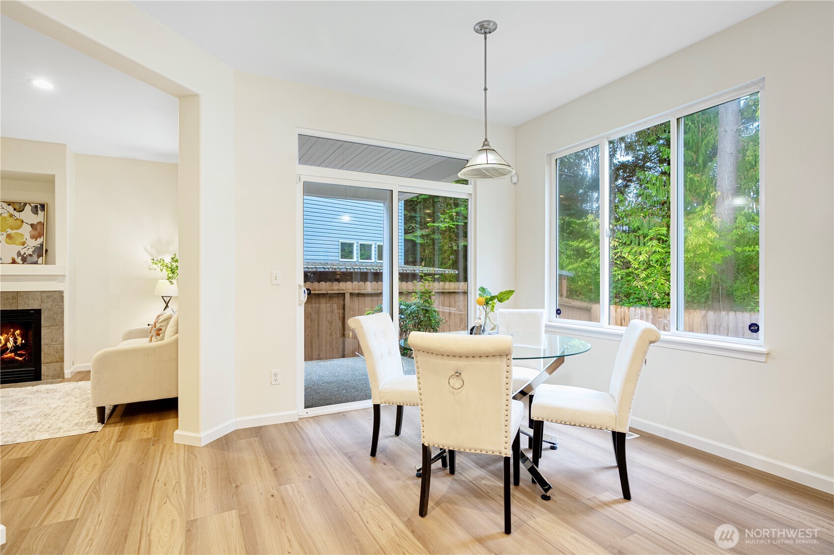 465 Field Place Northeast Renton, WA 98059 - Photo 9 of 25 a dining room with furniture a chandelier and wooden floor