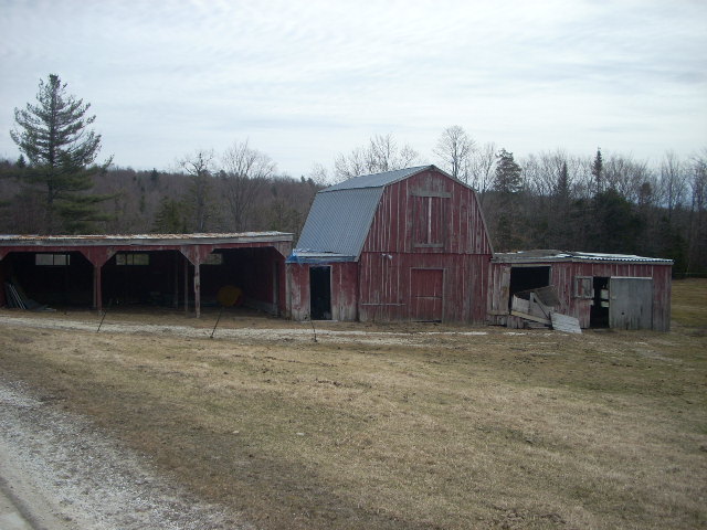 1122 Main Road Savoy, MA 01256 - Photo 2 of 2 a view of a wooden house with a yard and wooden fence
