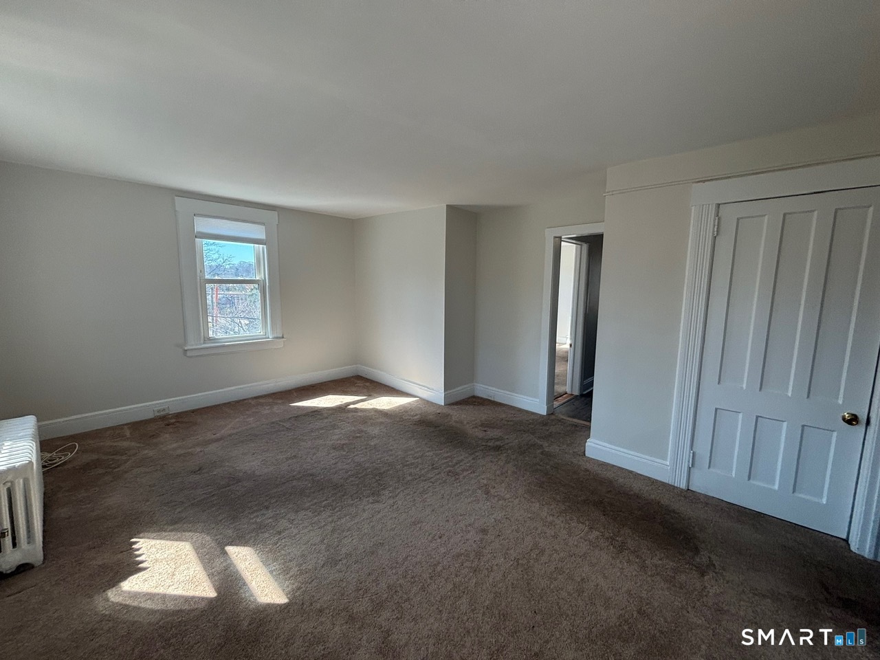 a view of a window in an empty room