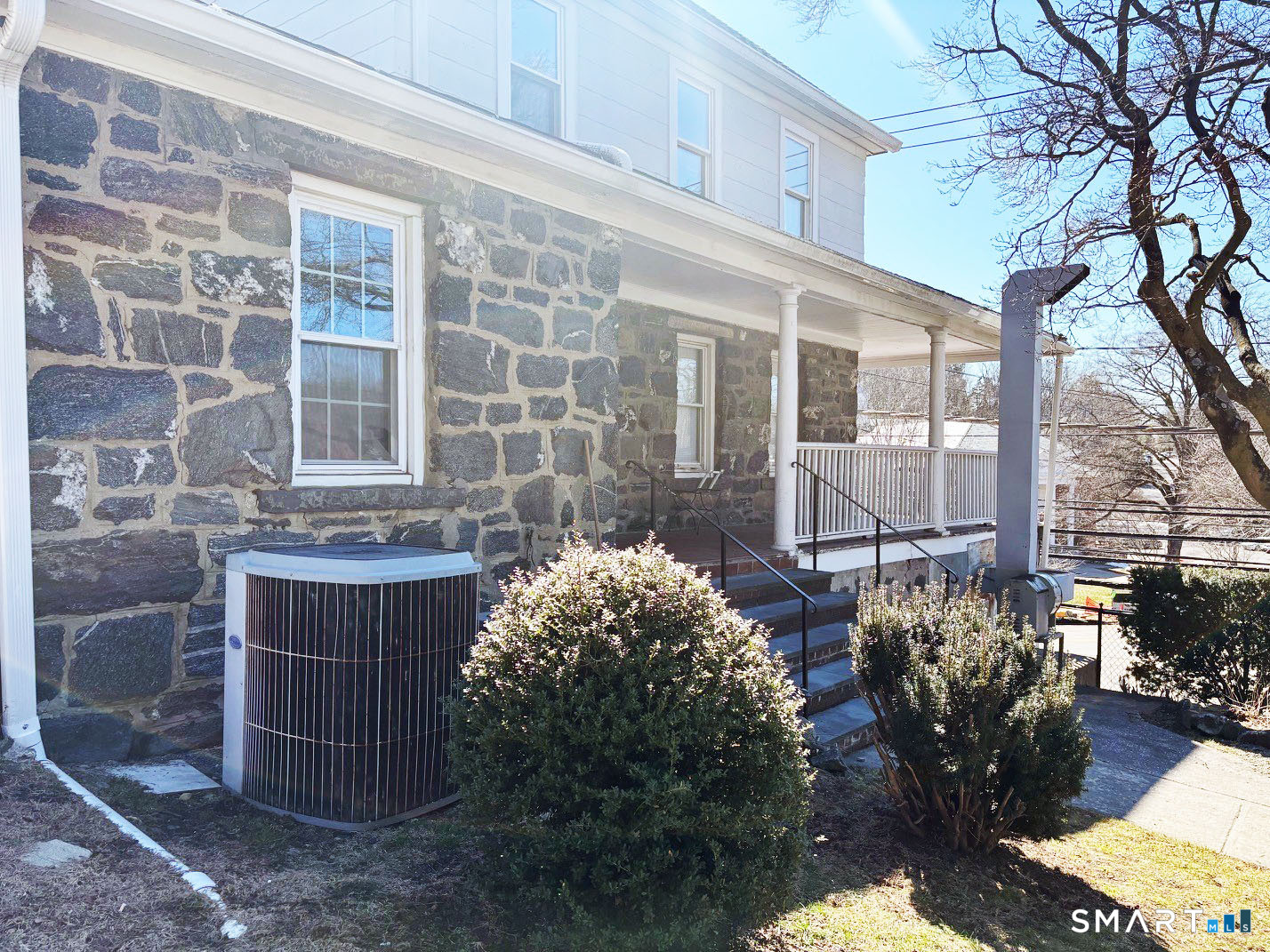 243 Glenville Road Greenwich, CT 06831 - Photo 7 of 10 a flower garden and tree in front of it