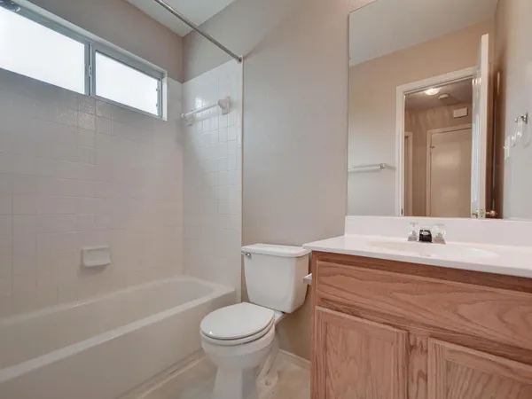 a bathroom with a sink a toilet and a bathtub