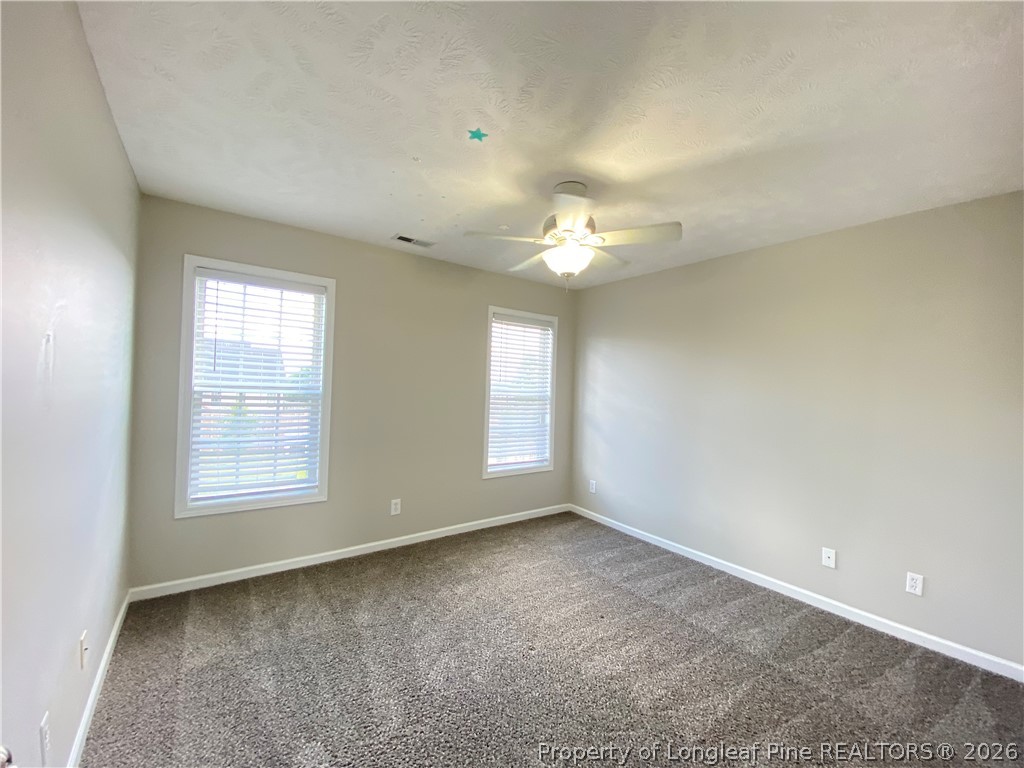58 Polk Street Spring Lake, NC 28390 - Photo 19 of 26 a view of an empty room with a window