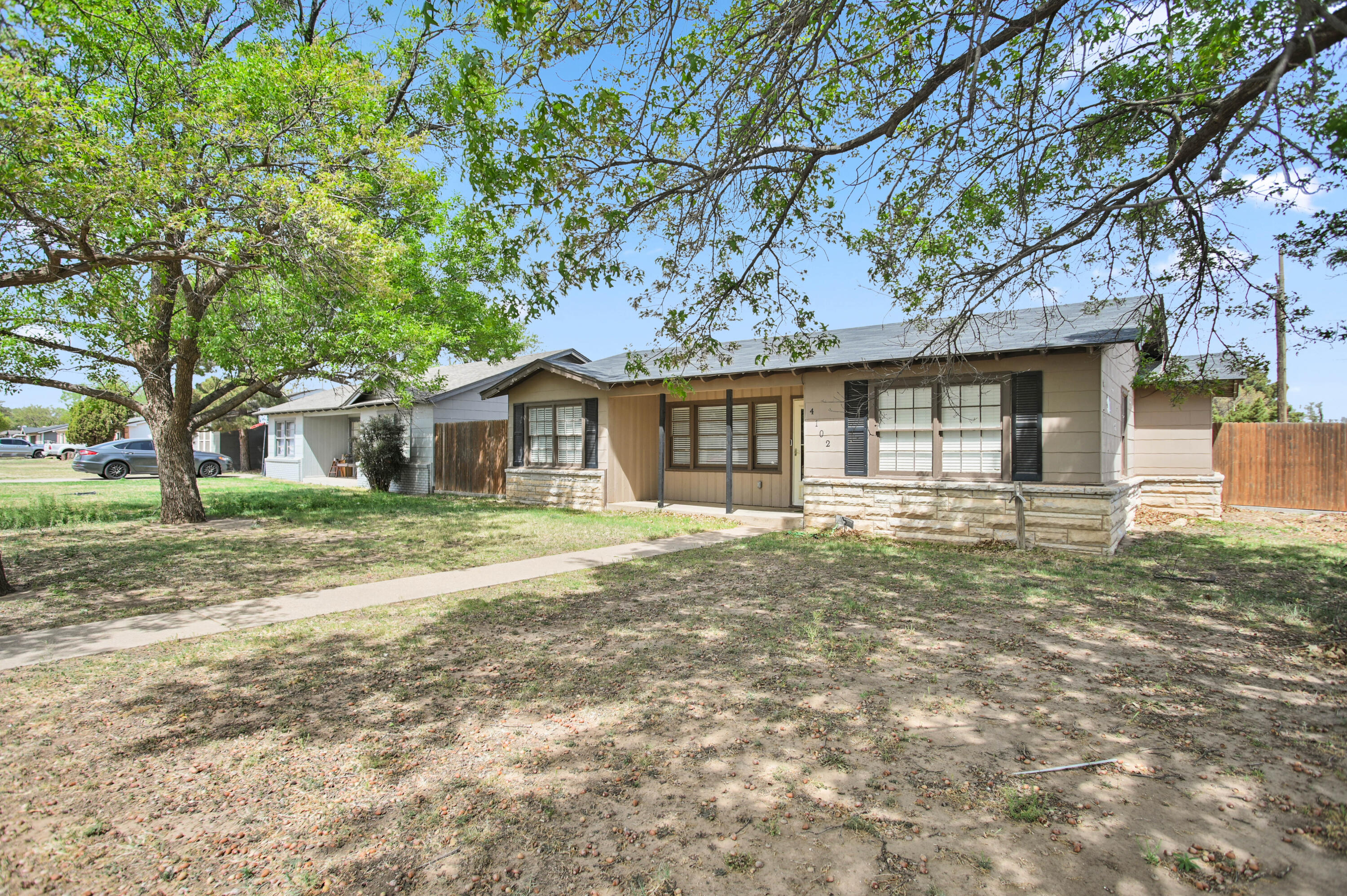 4102 32nd Street Lubbock, TX 79410 - Photo 2 of 40 a front view of a house with a garden