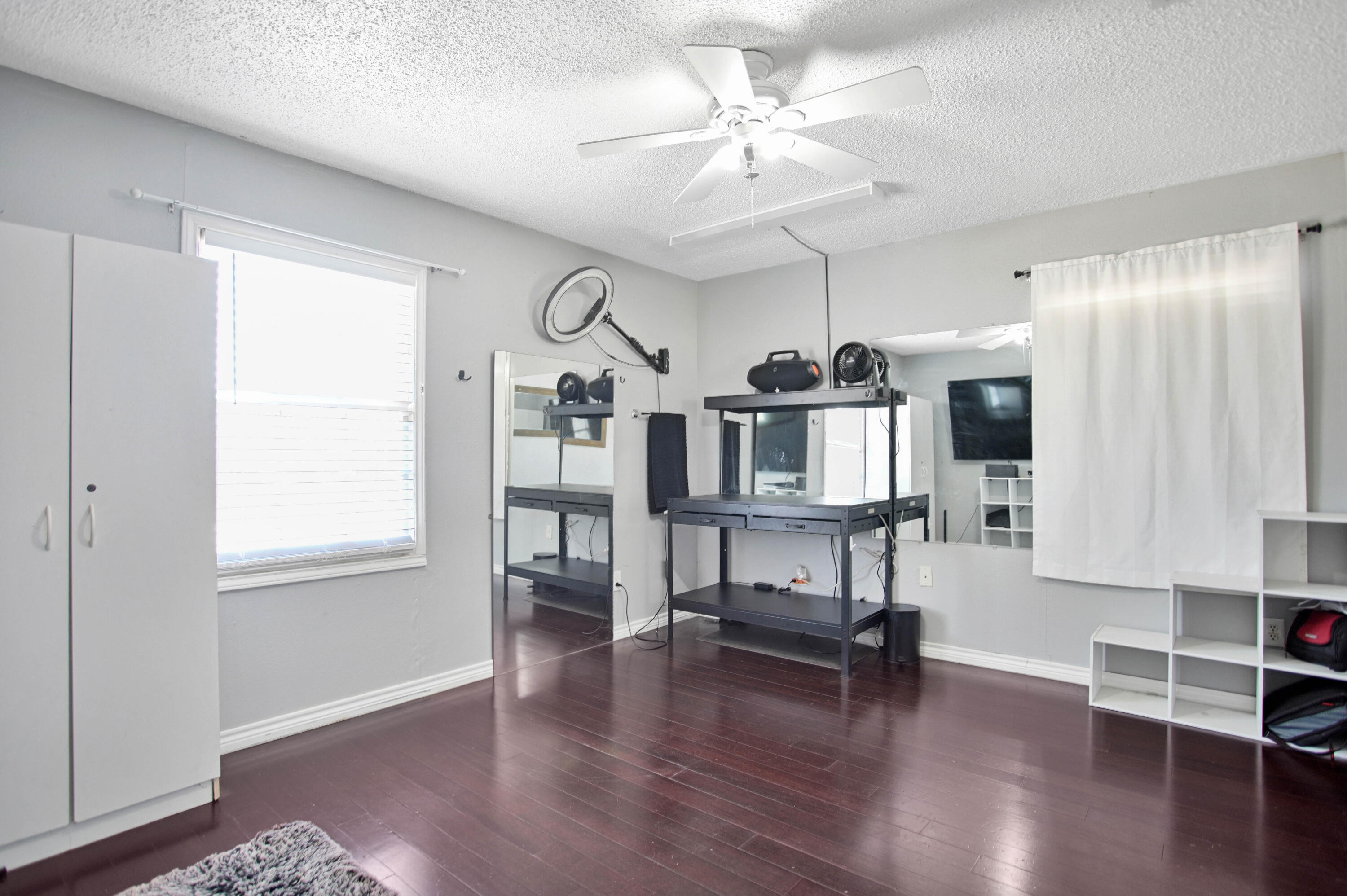 4102 32nd Street Lubbock, TX 79410 - Photo 27 of 40 a living room with furniture and a wooden floor