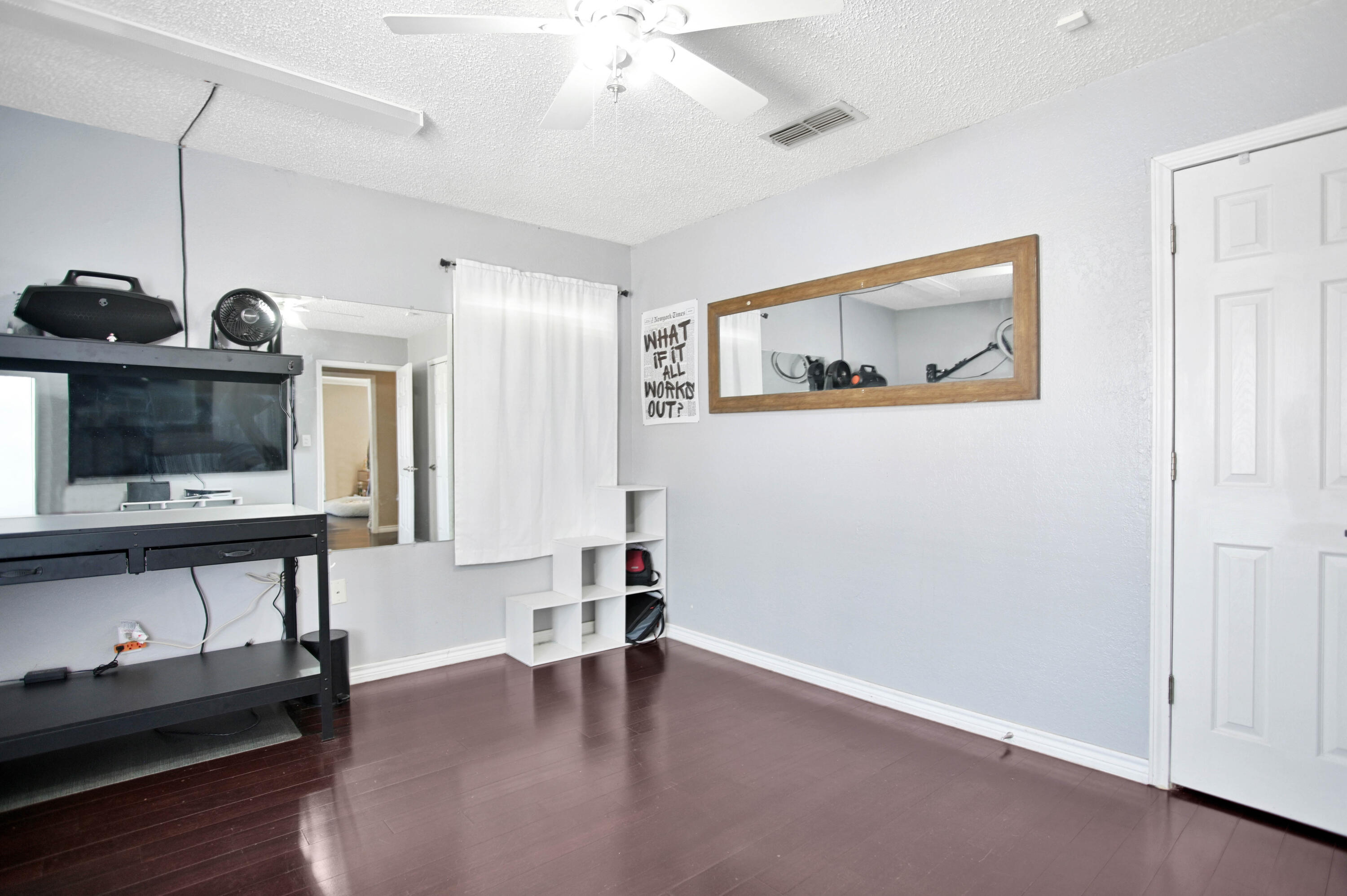 4102 32nd Street Lubbock, TX 79410 - Photo 28 of 40 a view of room with furniture and wooden floor