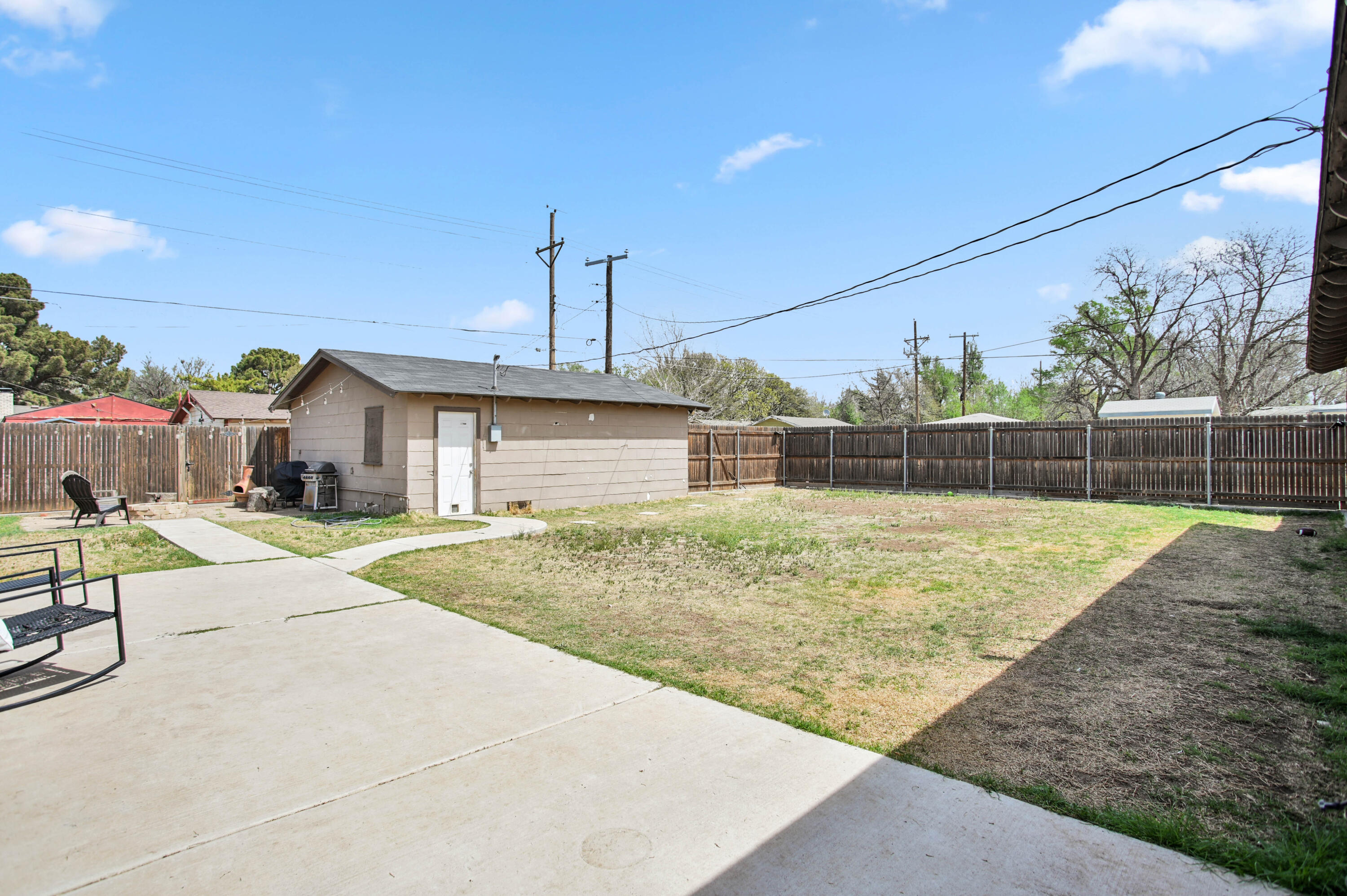 4102 32nd Street Lubbock, TX 79410 - Photo 32 of 40 a front view of a house with a yard