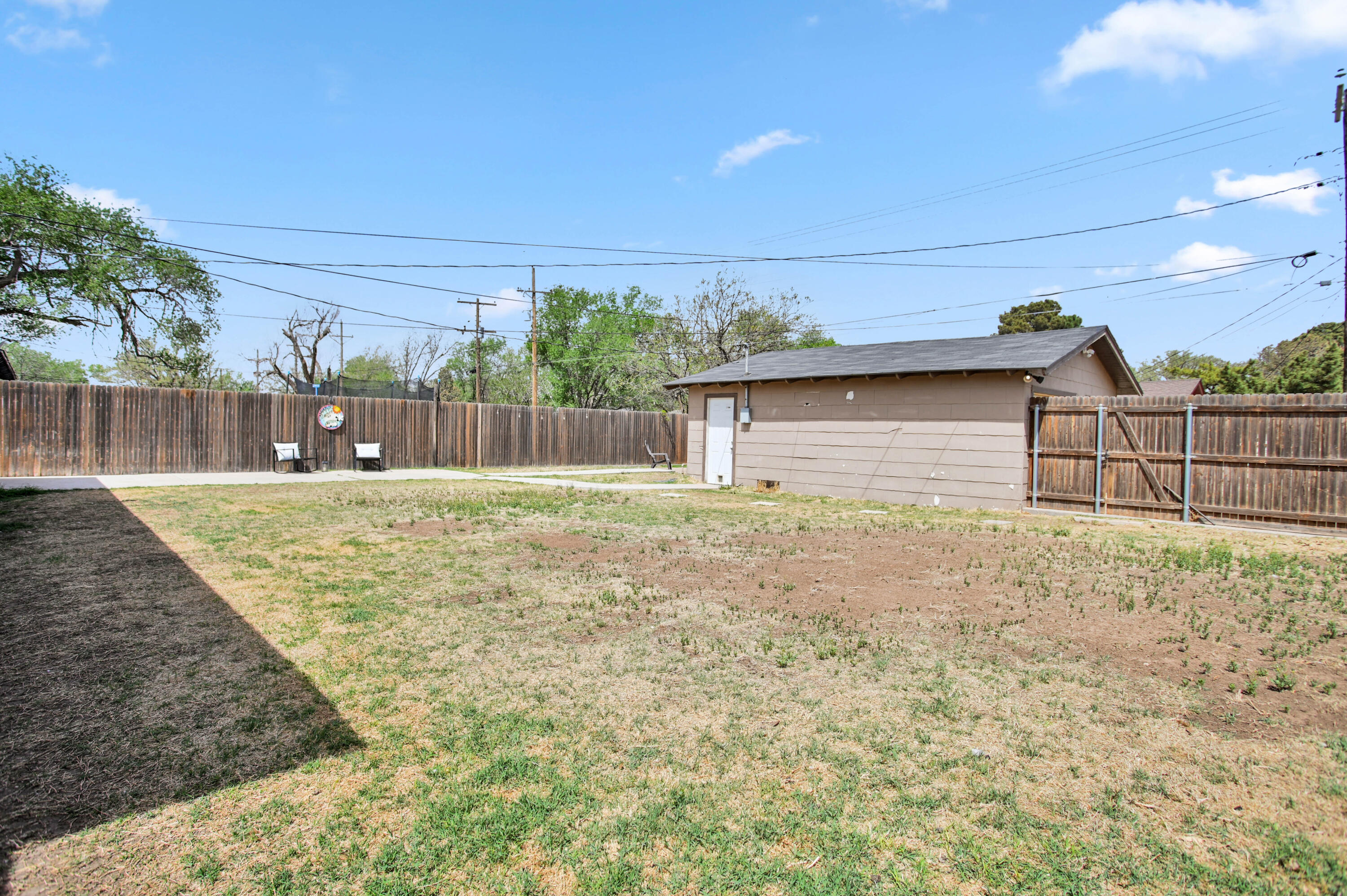 4102 32nd Street Lubbock, TX 79410 - Photo 33 of 40 a backyard of a house with lots of green space