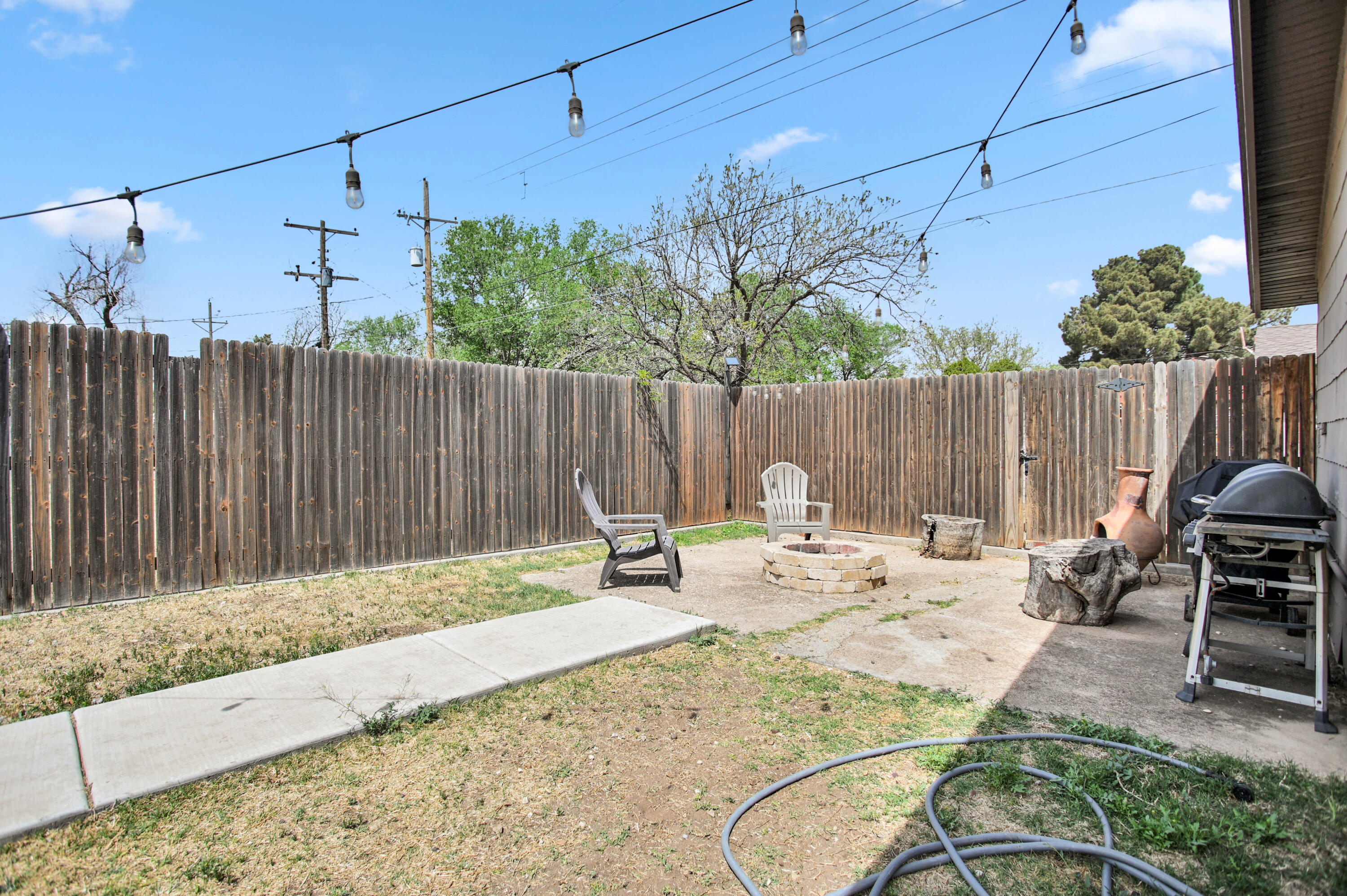 4102 32nd Street Lubbock, TX 79410 - Photo 36 of 40 a view of backyard with a table and chairs