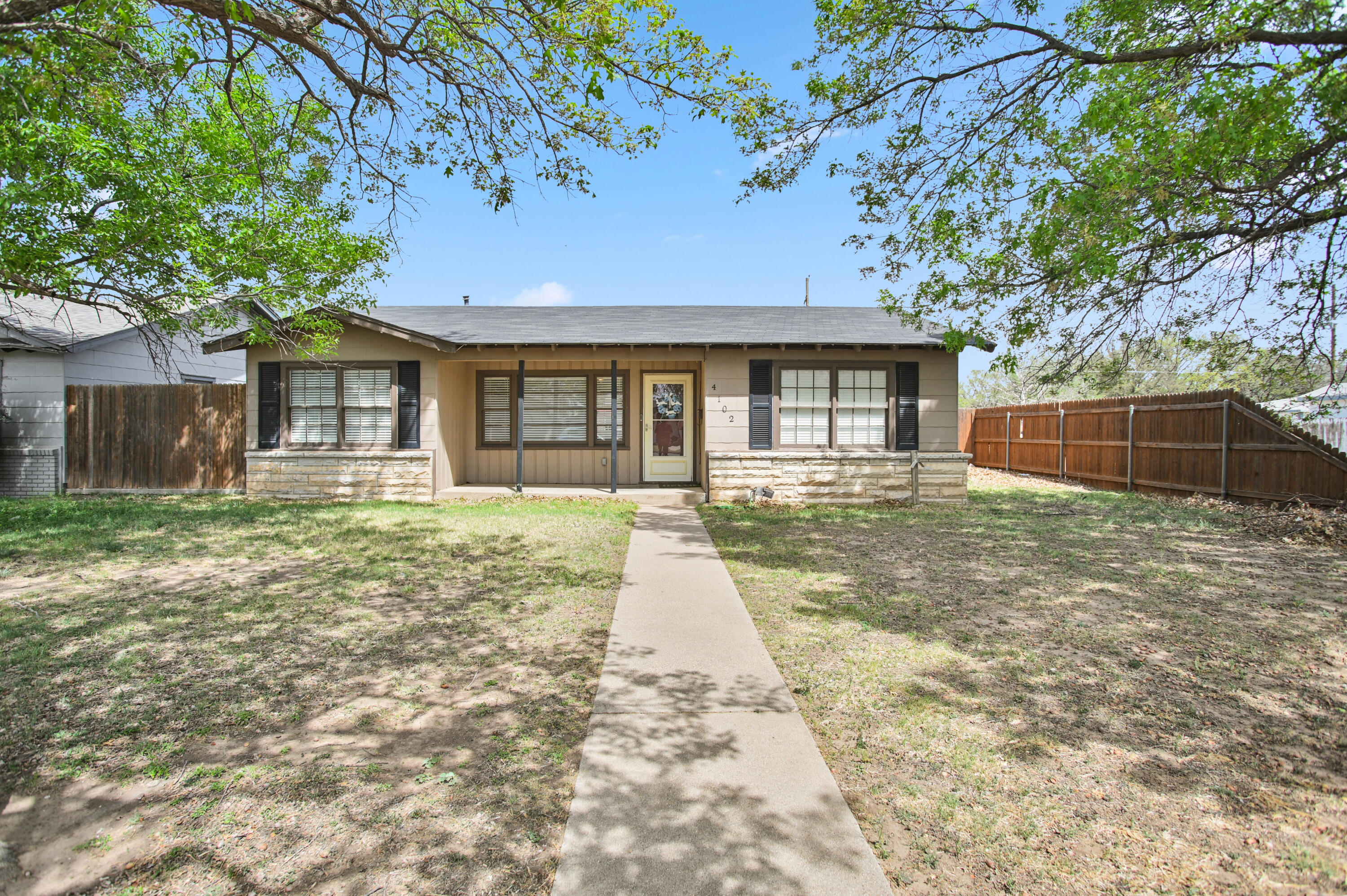 4102 32nd Street Lubbock, TX 79410 - Photo 39 of 40 front view of a house with a yard
