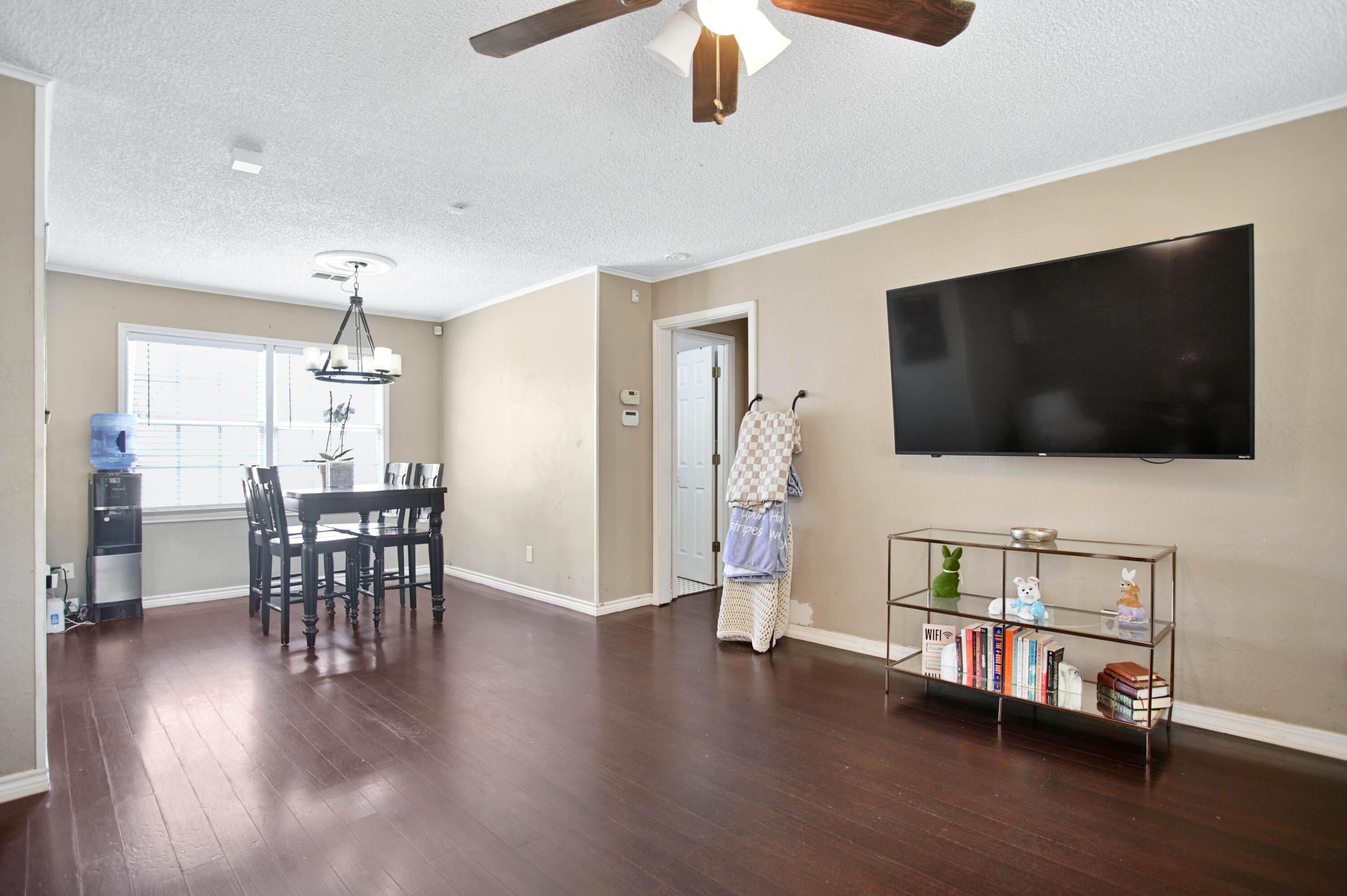 4102 32nd Street Lubbock, TX 79410 - Photo 5 of 40 a living room with furniture and a flat screen tv