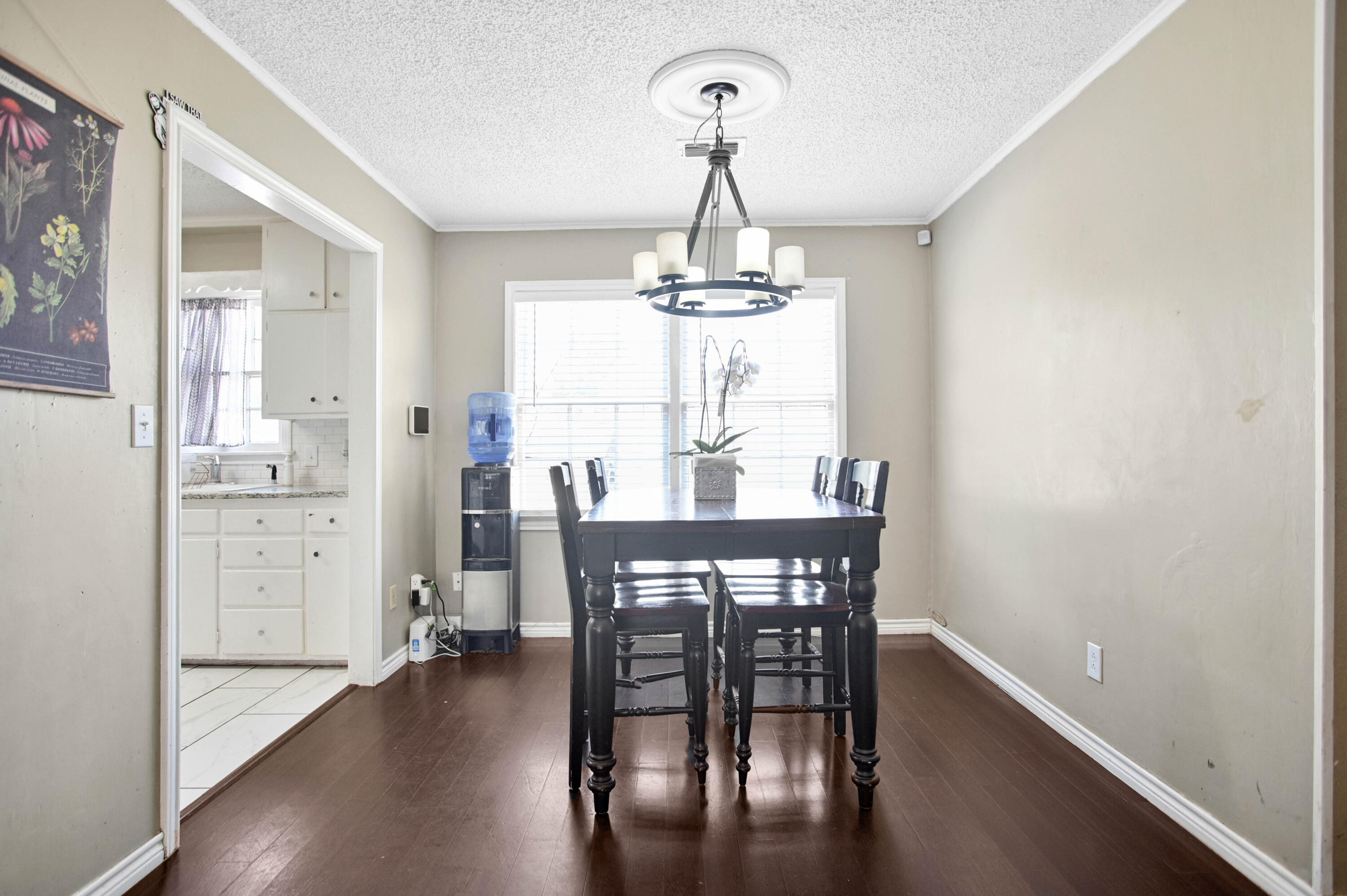 4102 32nd Street Lubbock, TX 79410 - Photo 9 of 40 a view of a dining room with furniture and wooden floor