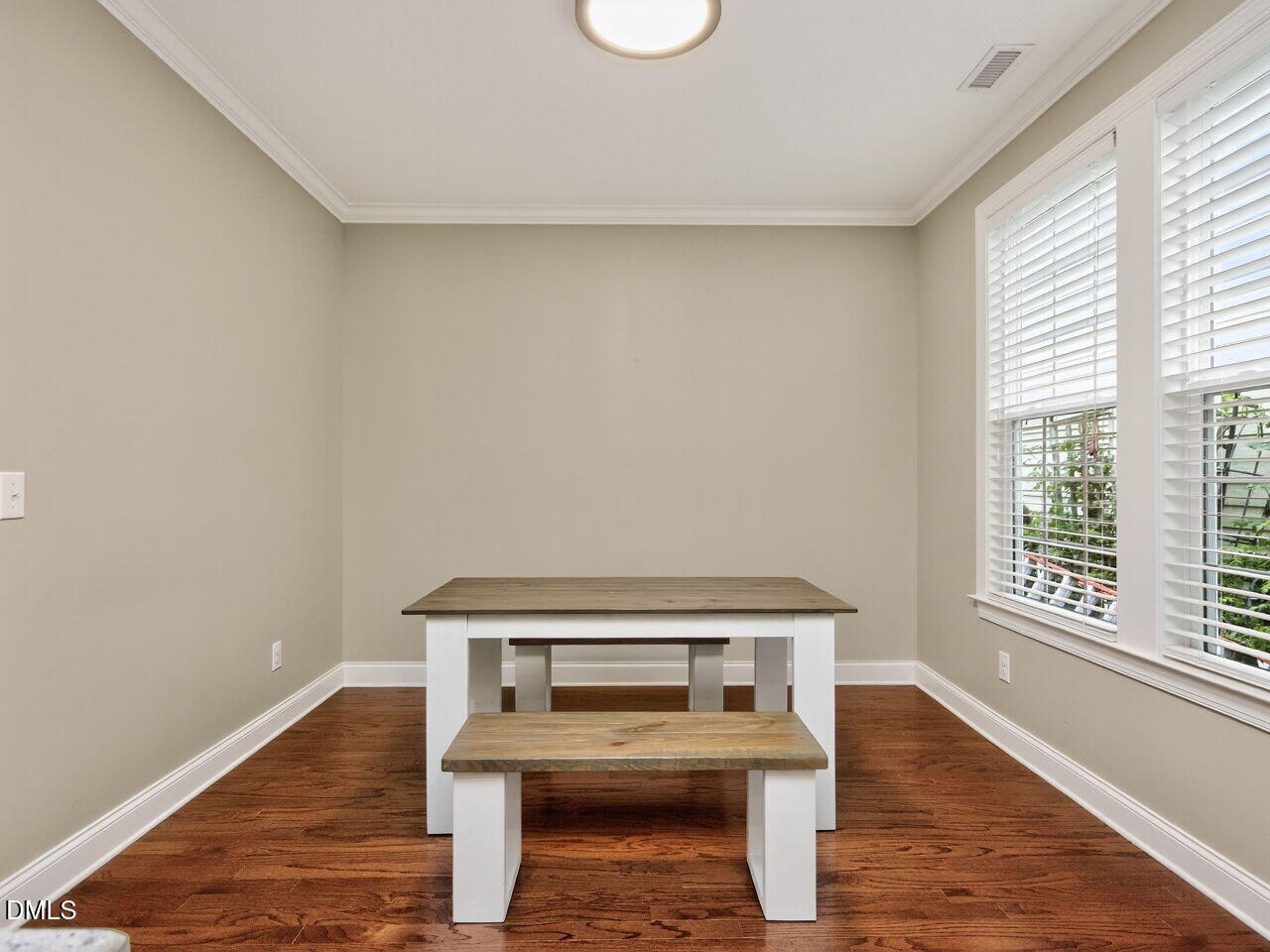 1133 Chapanoke Road Raleigh, NC 27603 - Photo 13 of 48 a living room with a table and a window